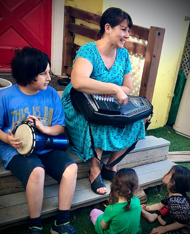 mother and son teaching music.