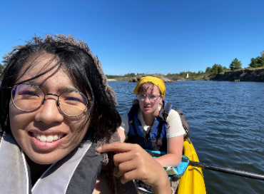Ivy and Maya in a kayak on the French River