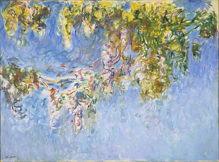 The photo is an image of a blue painting with colorful, gestural brush strokes. The strokes are concentrated at the top of the painting and appear to be branches with hanging green leaves. 