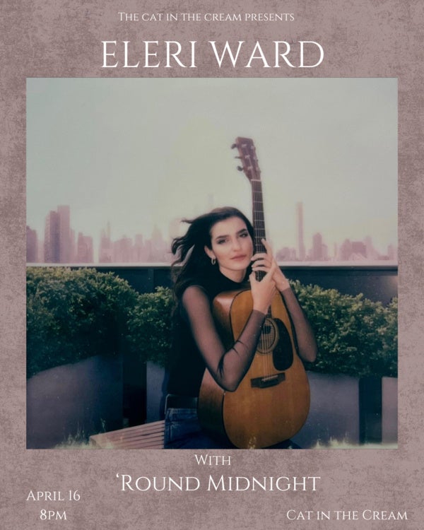 Photo of Eleri Ward with guitar on roof