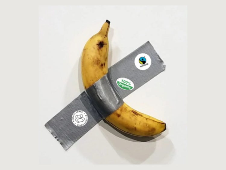 Banana taped to surface with duct tape