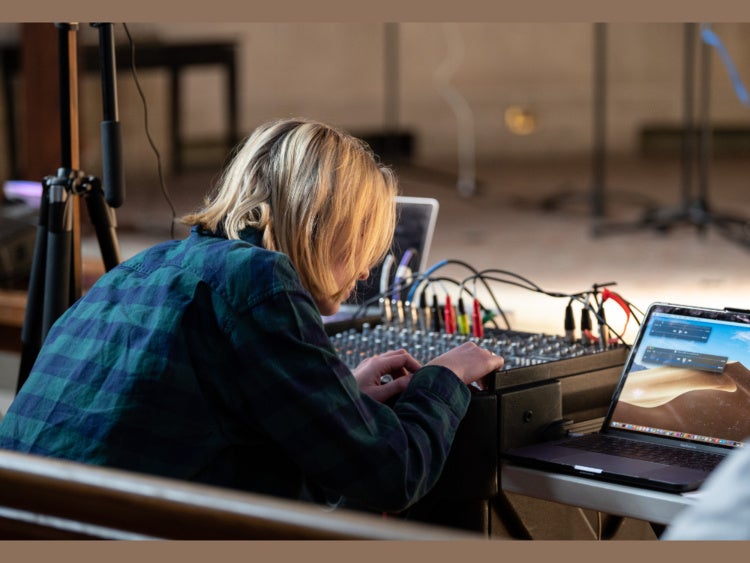 student working with soundboard 