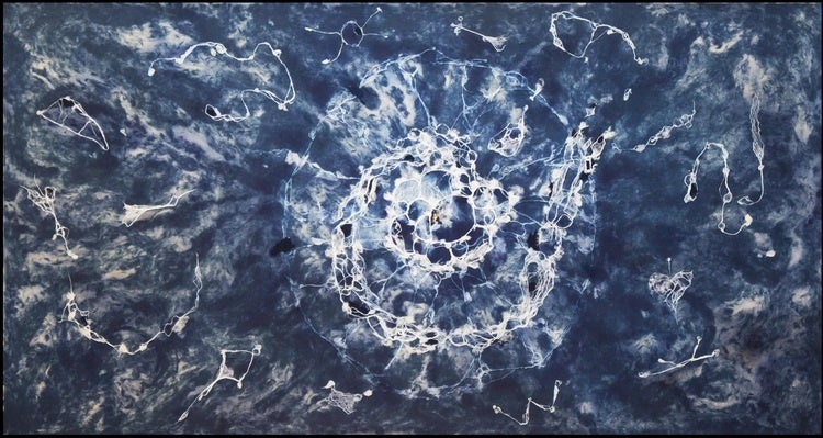 The photo is an image of an artwork that is dark blue and has a white spiral pattern, most concentrated in the center of the image.
