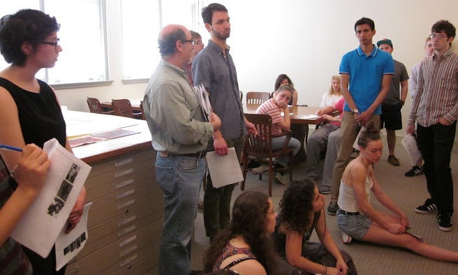 Professor surrounded by students