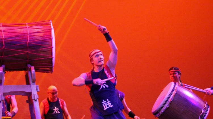 People standing near Taiko drums
