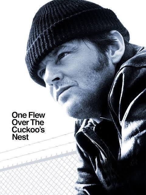 Jack Nicholson looks out on a white background with a barbed wire fence behind him. In the lower left corner, the text "One Flew Over The Cuckoo's Nest".