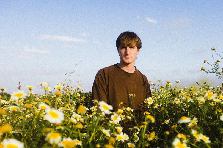 Will Paquin in a flower field