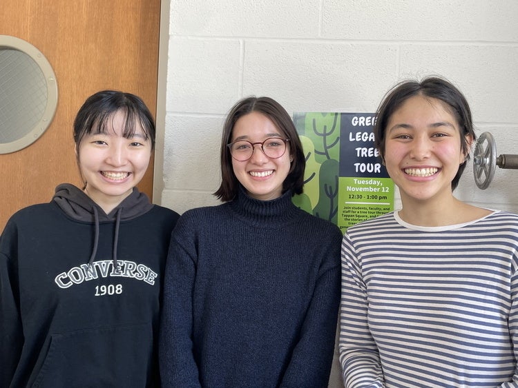 Three student presenters, smiling