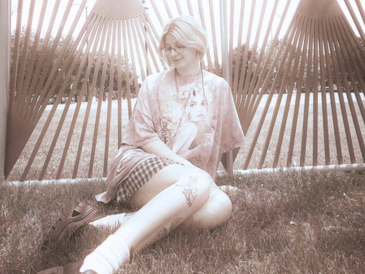 Hannah Sandoz in a grass field