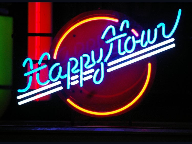 Neon sign for "happy hour"