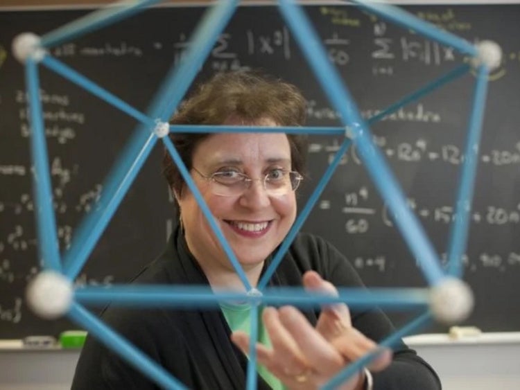 Susan Colley holding mathematical model