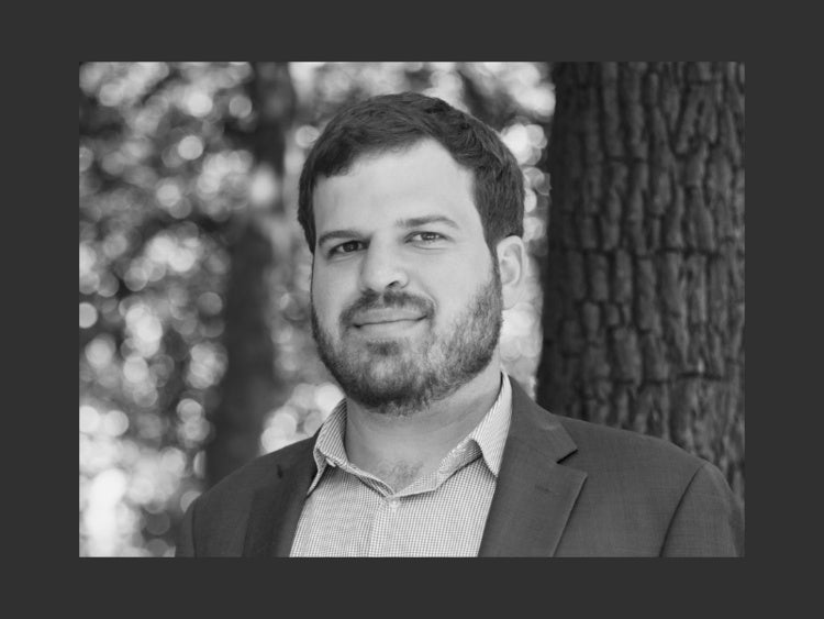 Black and white headshot of Geoffrey Levin