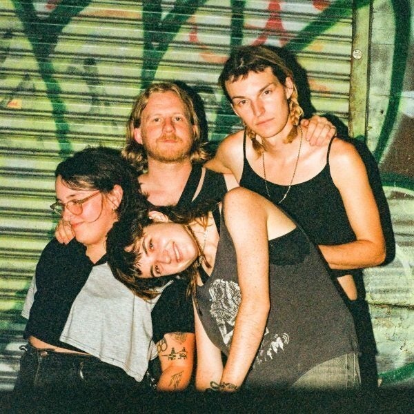 Four members of indie folk band Sadurn posed for their newest album, Radiator. 