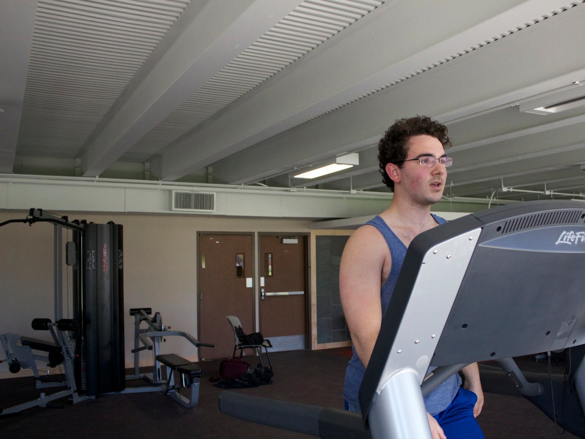 A student exercises on a treadmill