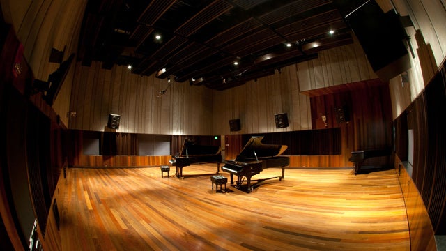 Two grand pianos in a recording studio
