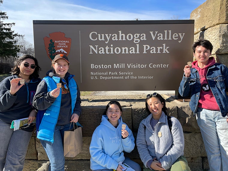 Students in front of a sign that reads "Cuyahoga Valley National Park."