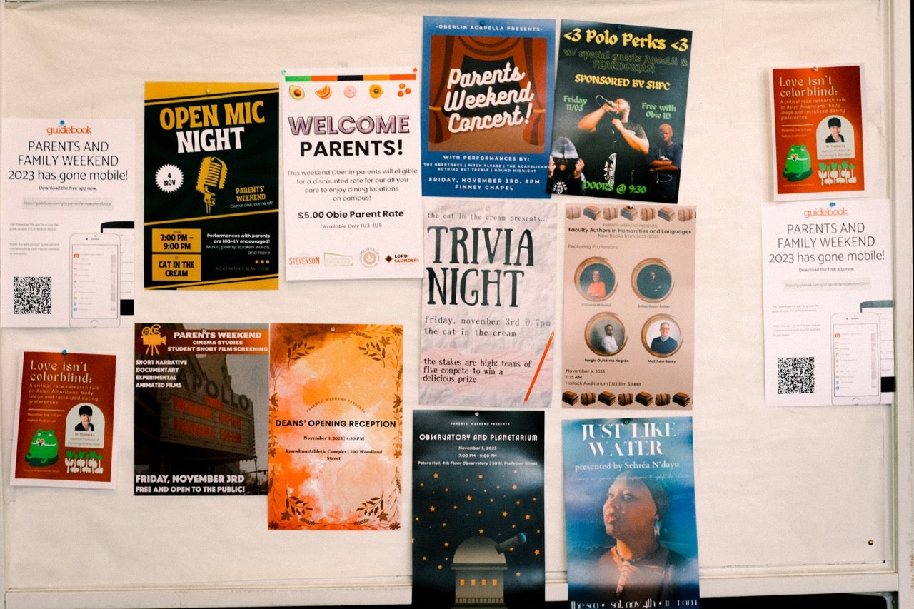 A wall of posters of events happening during Parents Weekend.