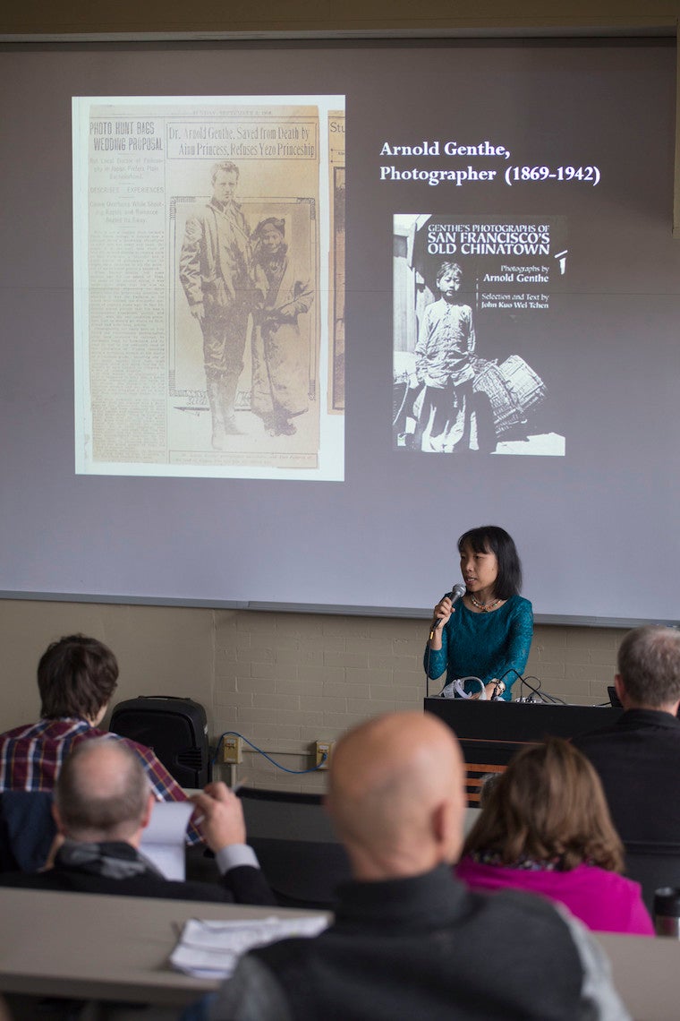 Woman standing at podium.