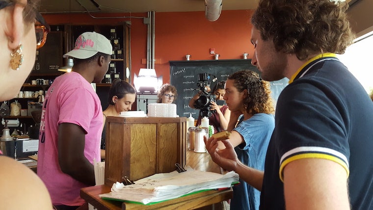 Image of students filming "CRSHD" at the Slow Train Cafe in Oberlin