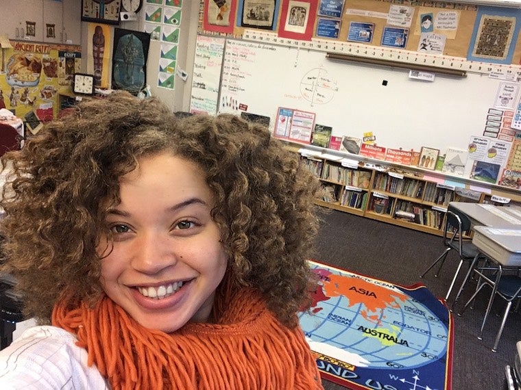 Kiela Nelson takes a selfie in a classroom