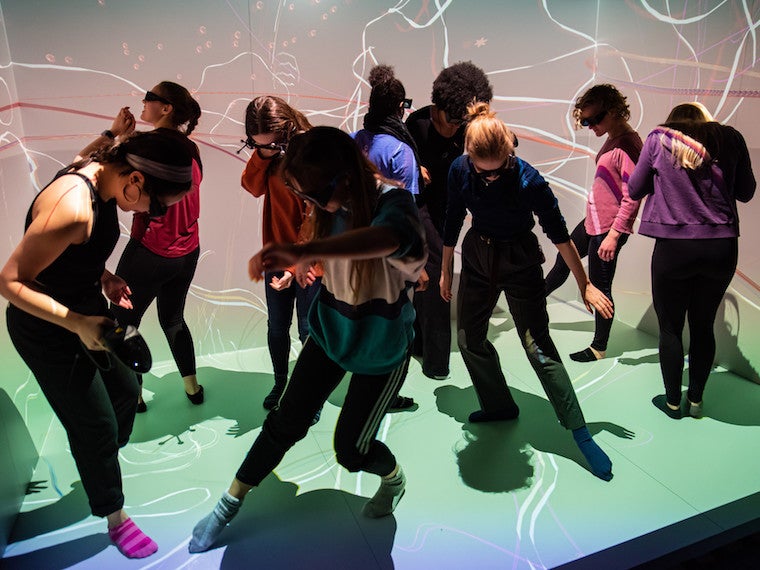 Students dance in a virtual room.