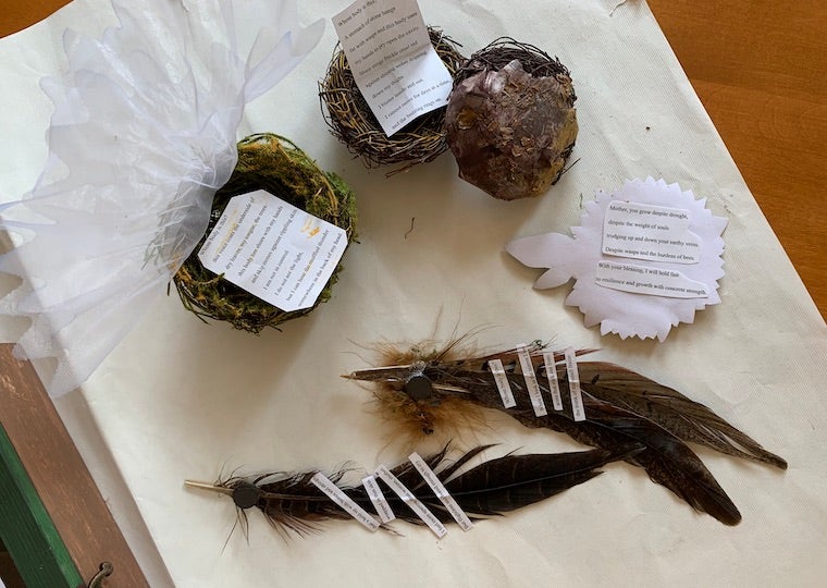 nests and feathers with pages glued to them.