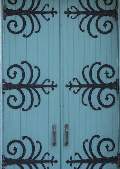 Down wooden downs made with strips of wood and embellished with hammered metal.