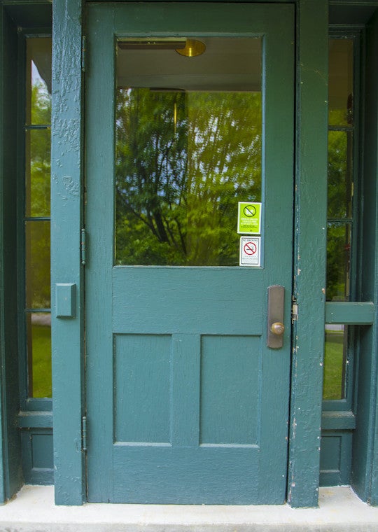 A door with a large glass window and two sidelights
