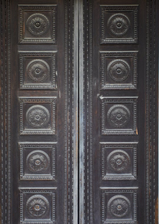 Slender tall double doors with eight panels.