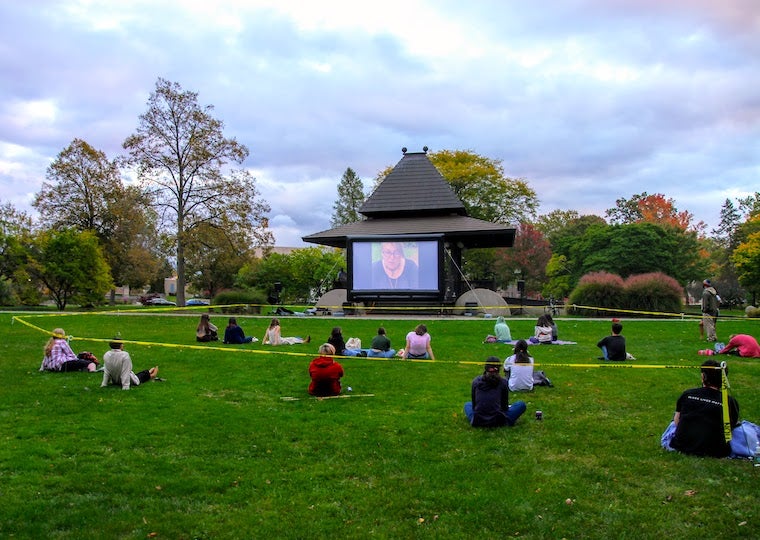 Student at an outdoor movie night.