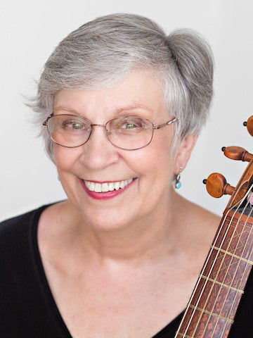 A portrait of a woman with an instrument next to her.