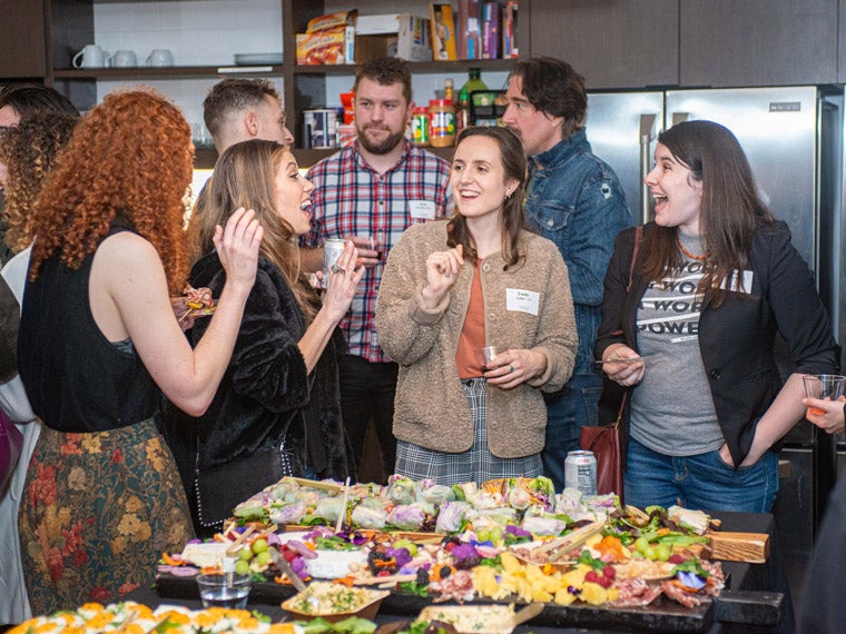 Recent alumni reconnect and share industry experiences. 