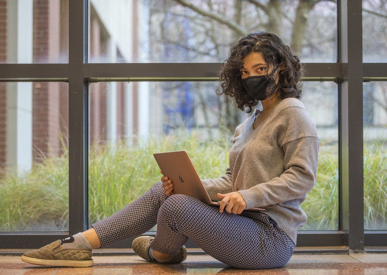 Alissa Leon seated in front of a window.