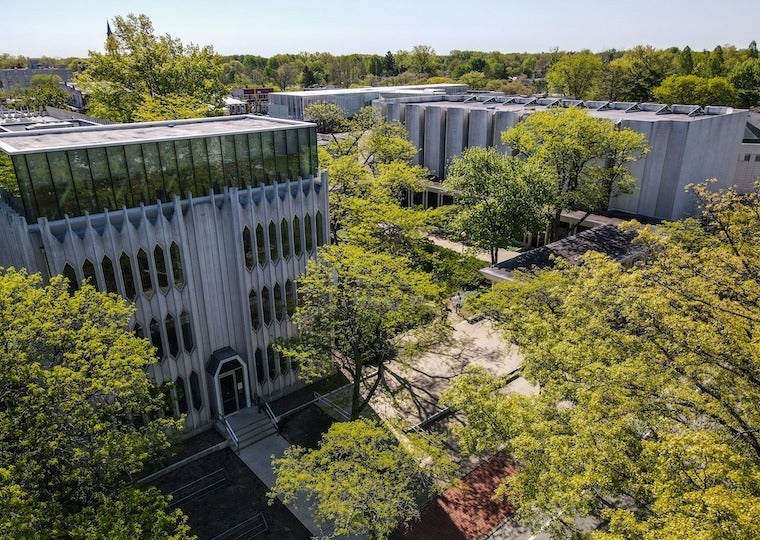 A picture of buildings and trees taken by a drone.