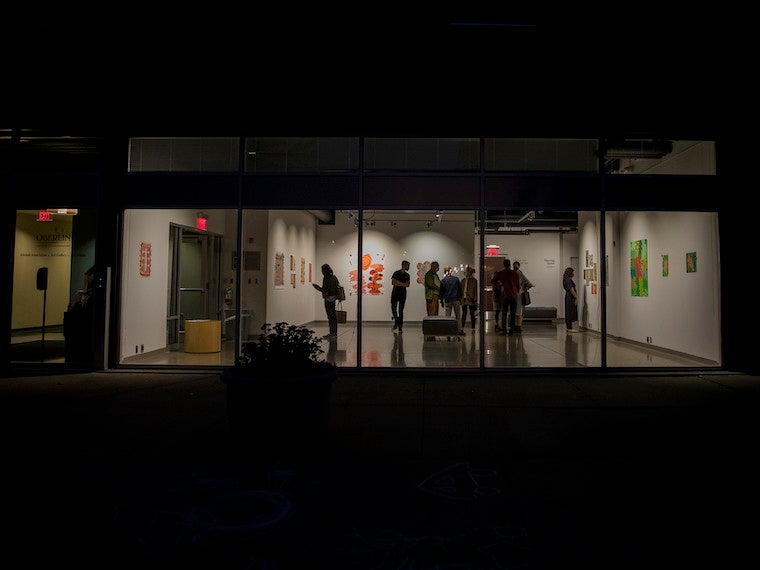A night photo of an art gallery.