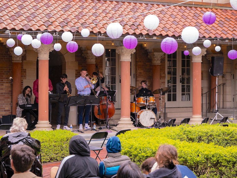 A jazz band plays in a courtyard.