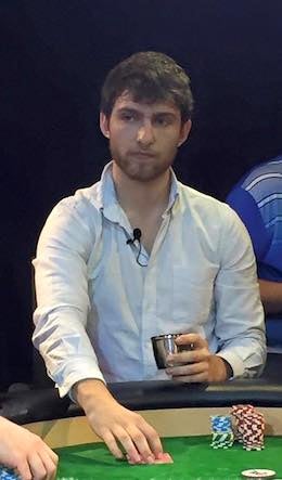 Zach at the poker table, with a microphone clipped to his shirt