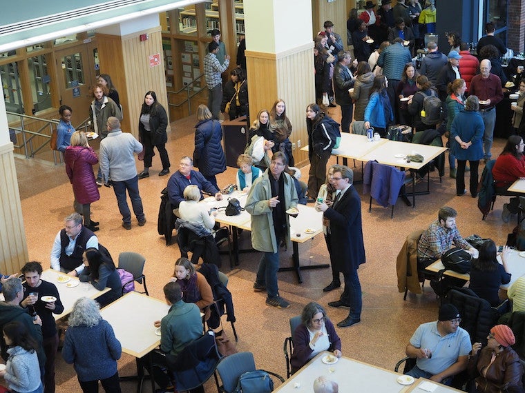 A large gathering of people in an atrium.