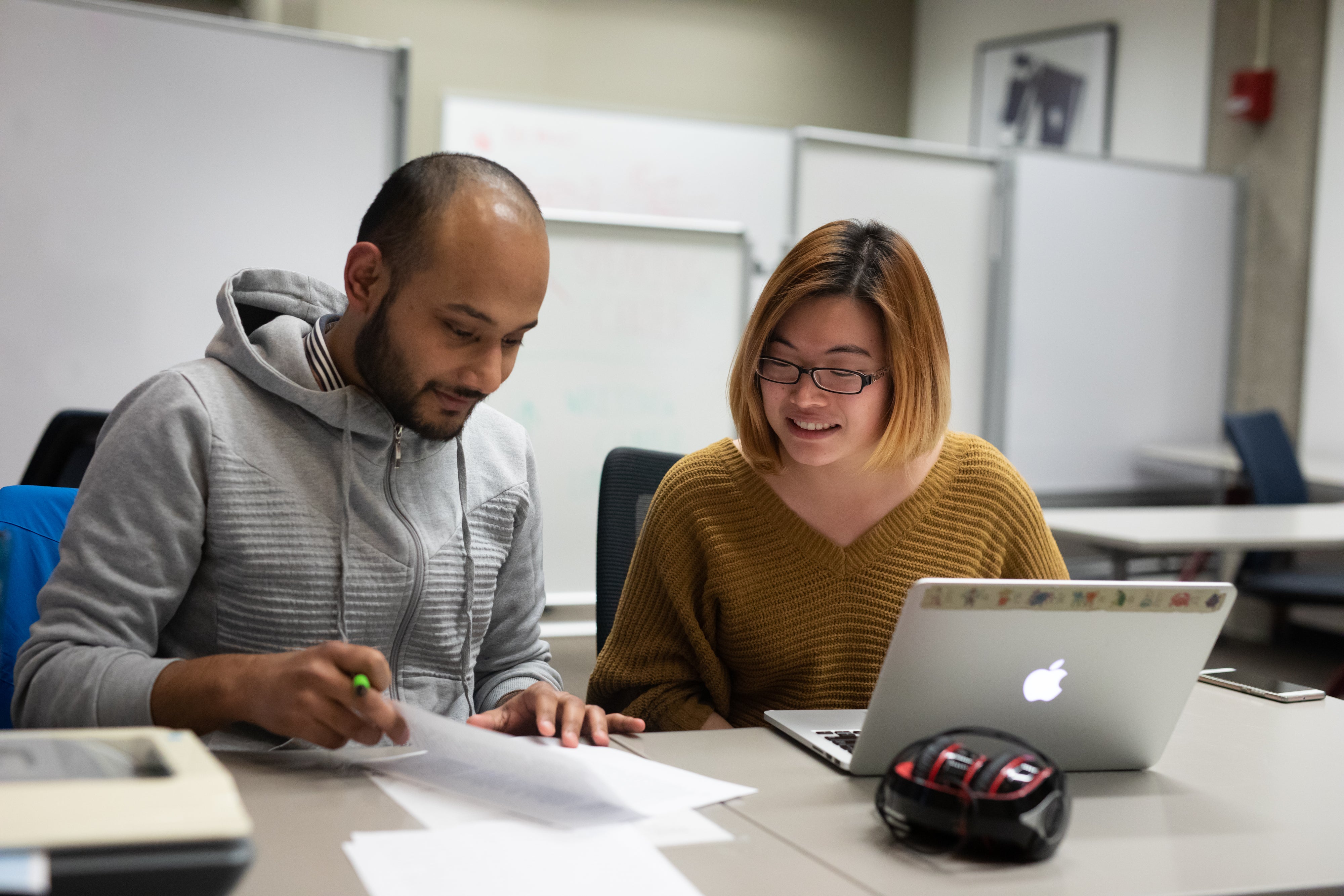 Two students reviewing an assignment together.