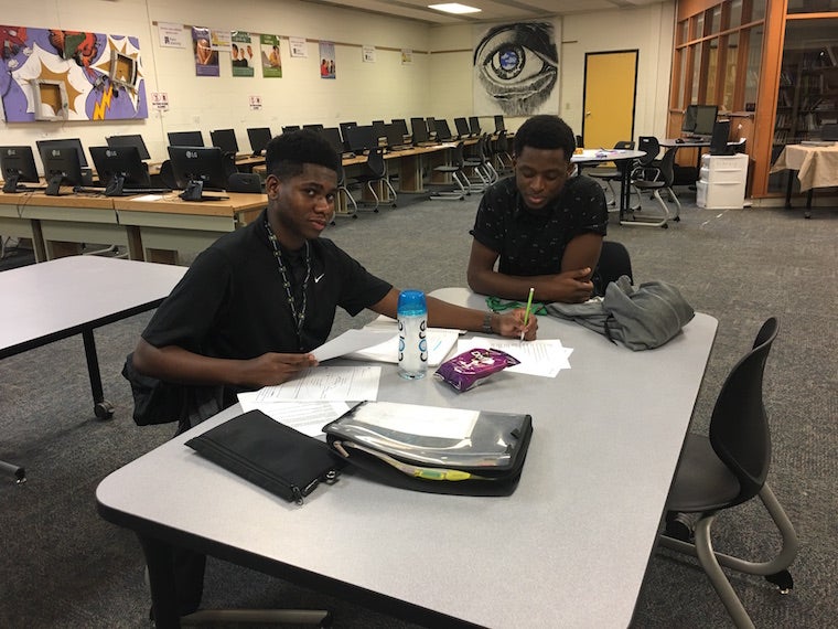 Oberlin College student tutoring a student from Oberlin High School.