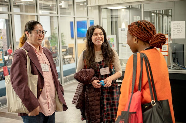 Three people chatting