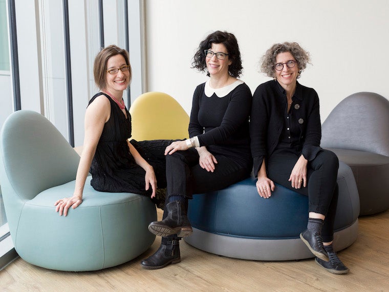 hree women professors sitting in cushy chairs. Photo.