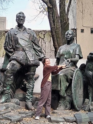 Anna in front of bronze statues of Malinche and Cortes