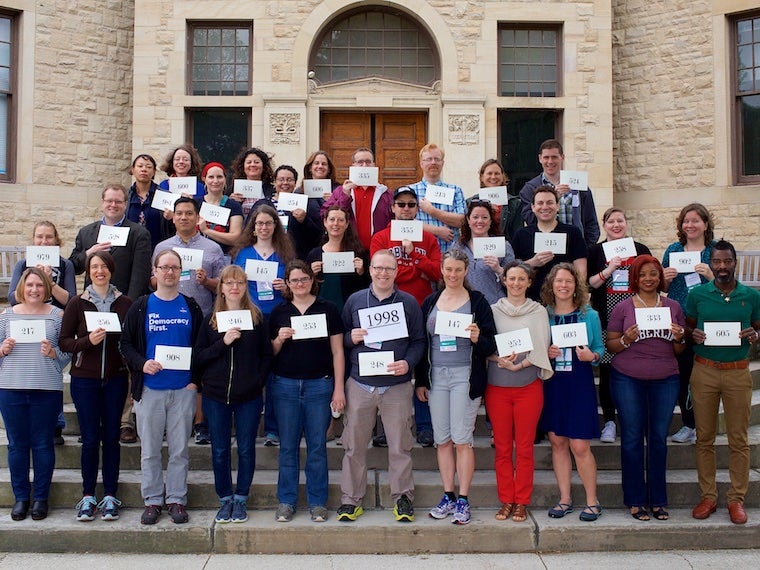 Photo of Class of 1998 with cards at CRW 2017