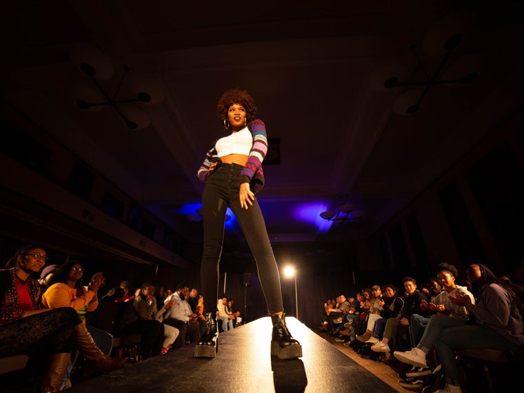 Person modeling during fashion show during Black History Month 2019.