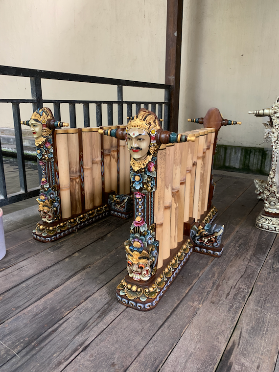 a percussion instrument with a carved head on the side