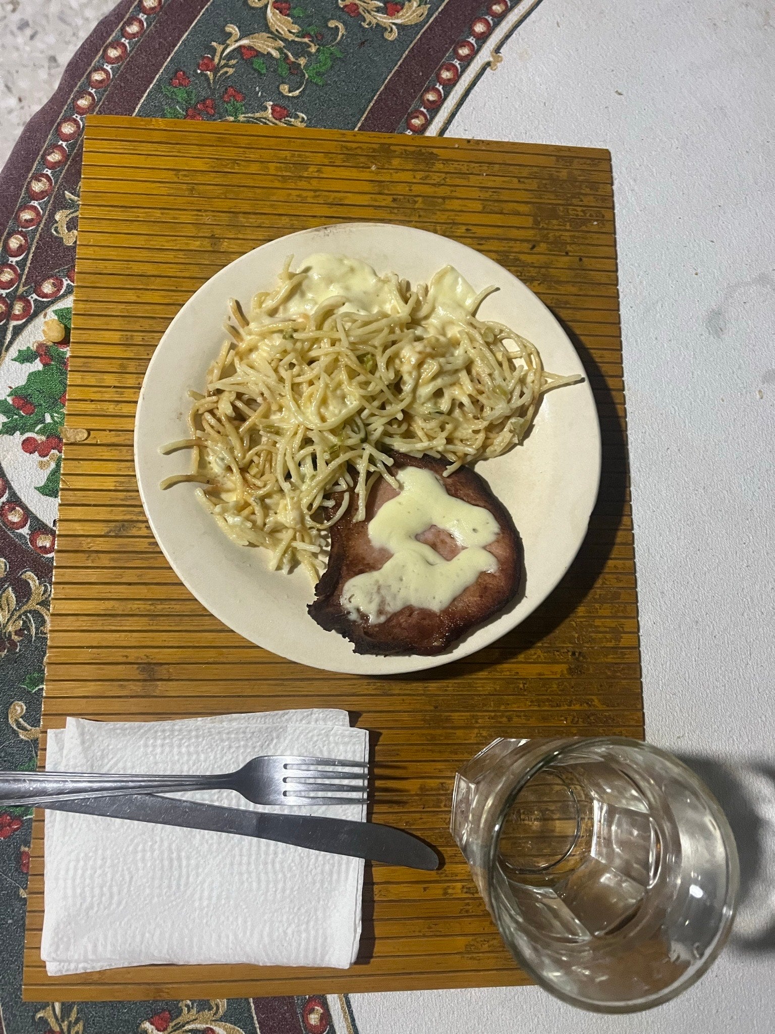 A meal of noodles and pork in a delicious cream sauce.