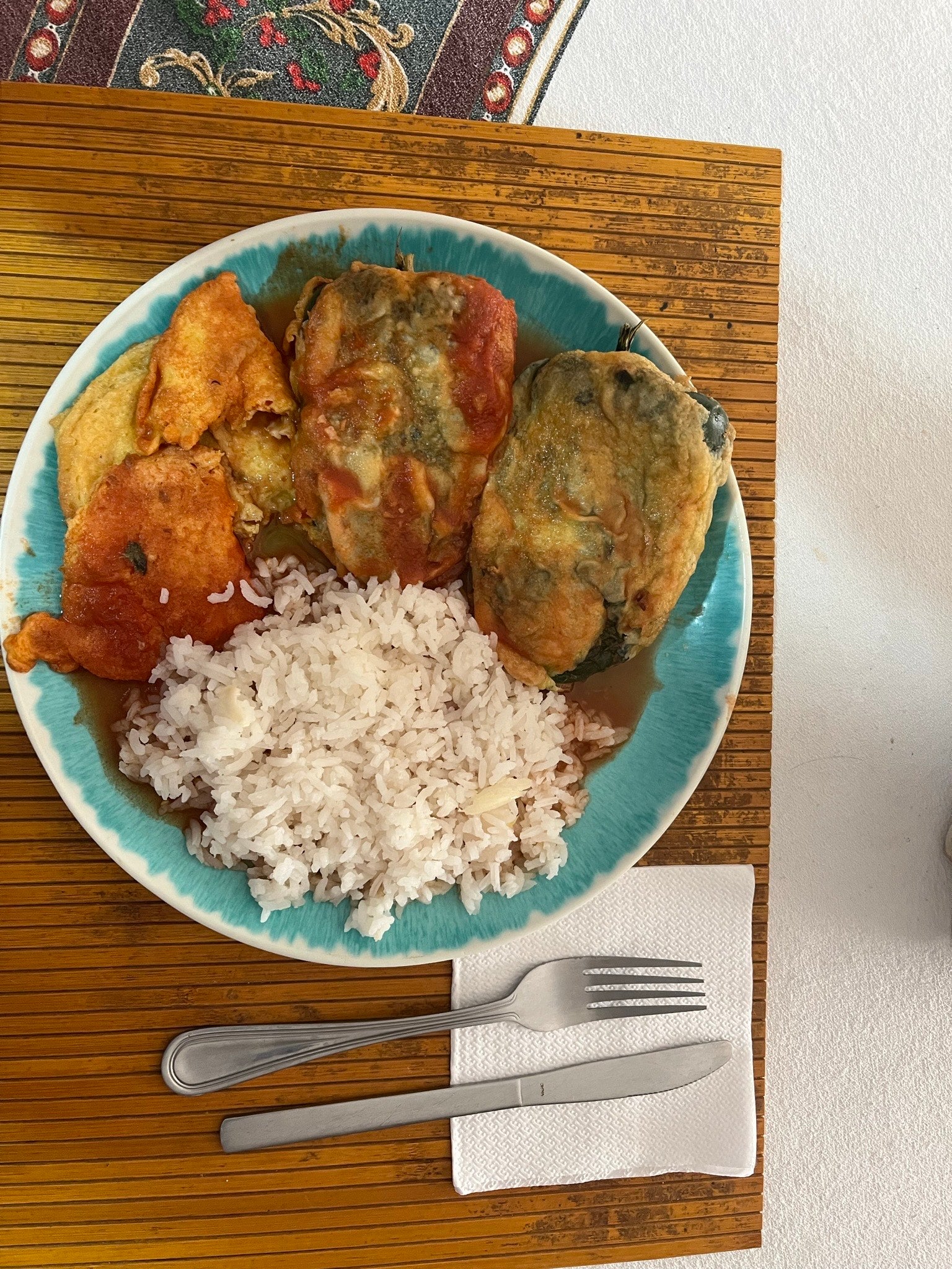 A meal of stuffed peppers and rice.