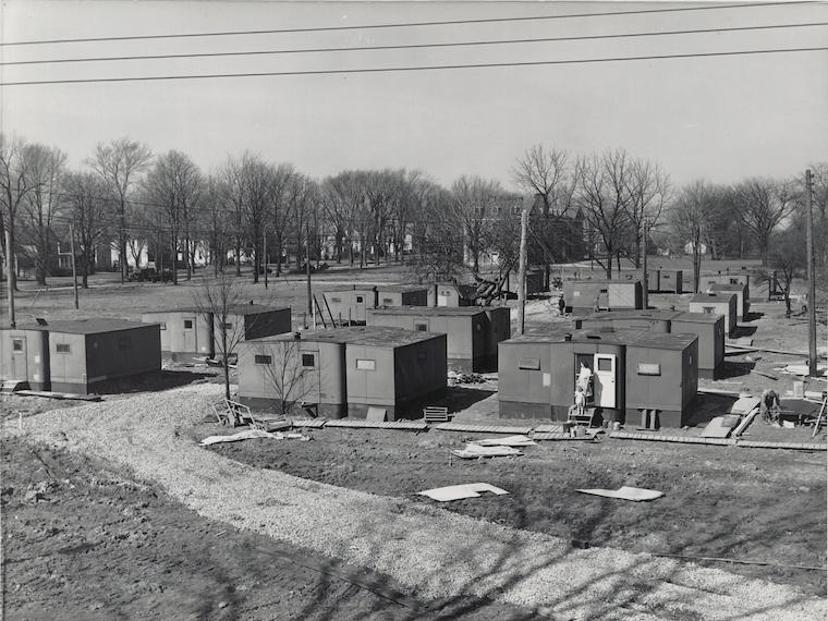 Gray-sided trailers on Lorain and Woodland streets.