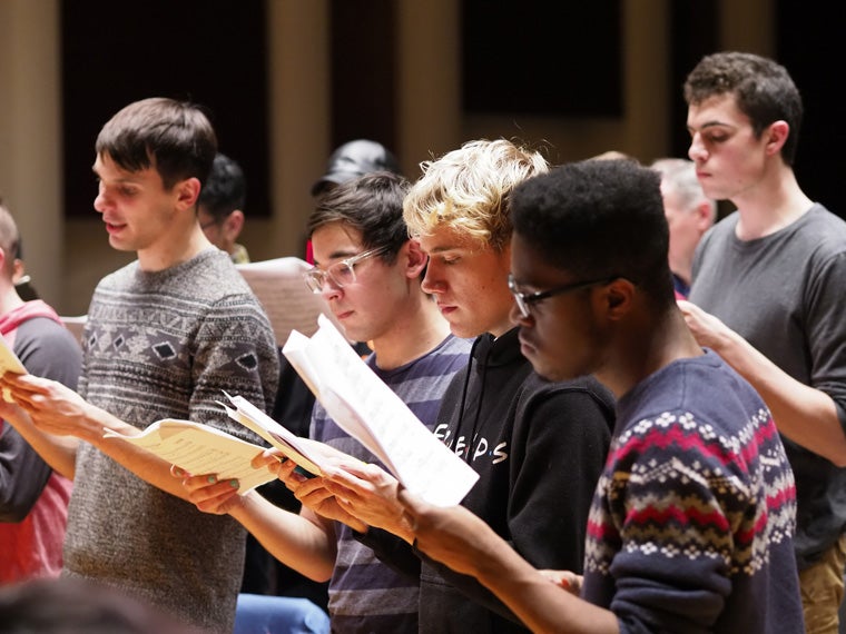 Students and staff gathered for a sing-along of spirituals and choral music by Moses Hogan.